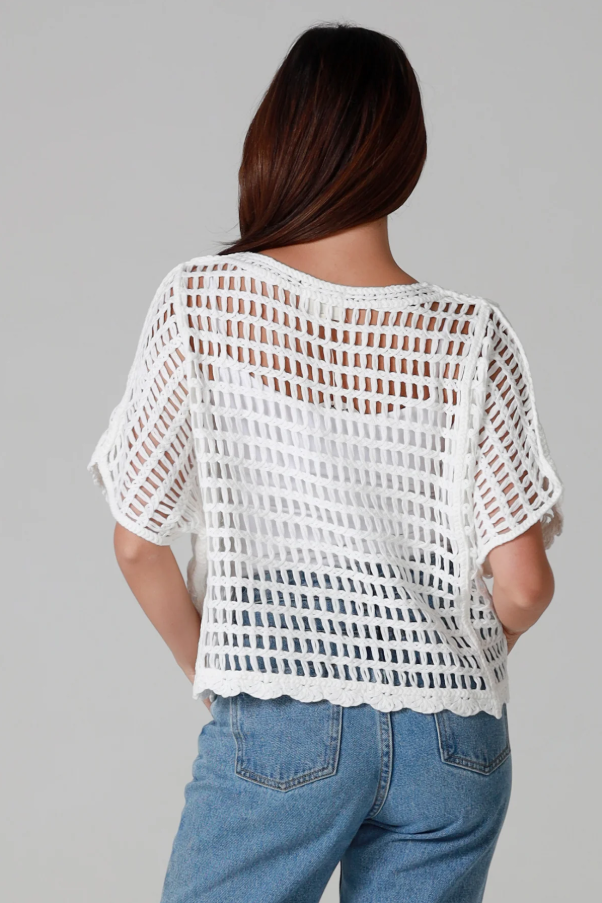 Woman wearing a white crochet tee by Willow. Sold by Godess Boutique on the Central Coast, New South Wales.